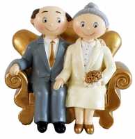 Goldenes Paar auf Sofa, Hochzeitsdeko